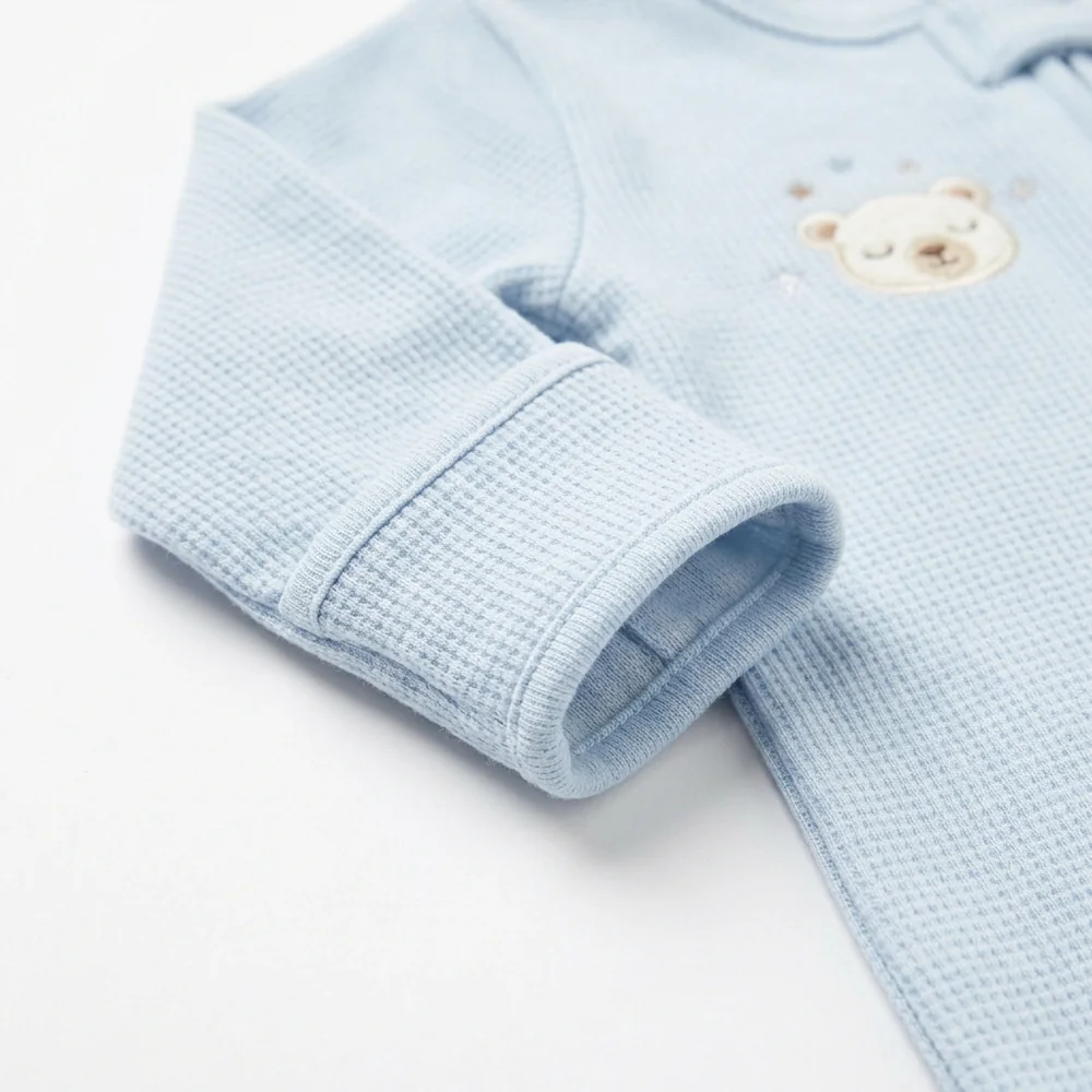 Fold-over mitten cuff and embroidered bear on the snösoft footie